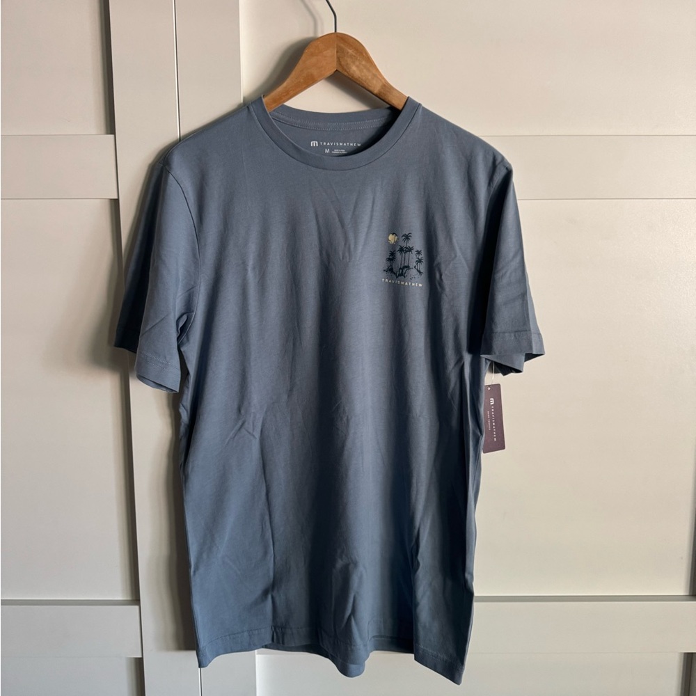 Travis Mathew Storm City Cotton Graphic Tee NWT size Medium Dark Tropics T-Shirt